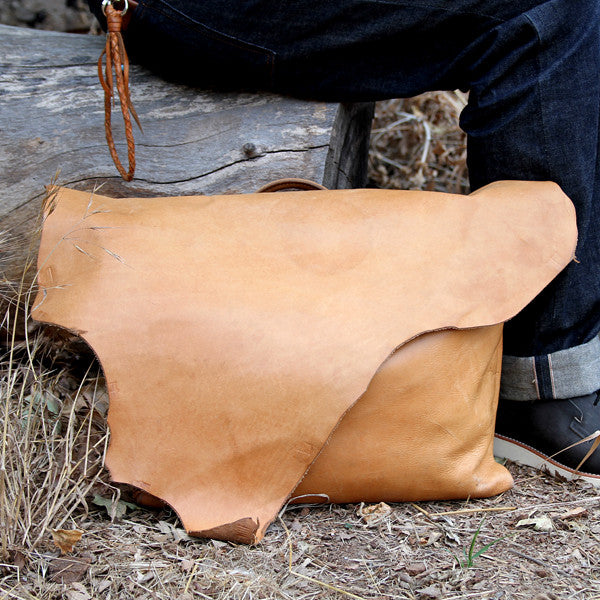 distressed well worn leather bag