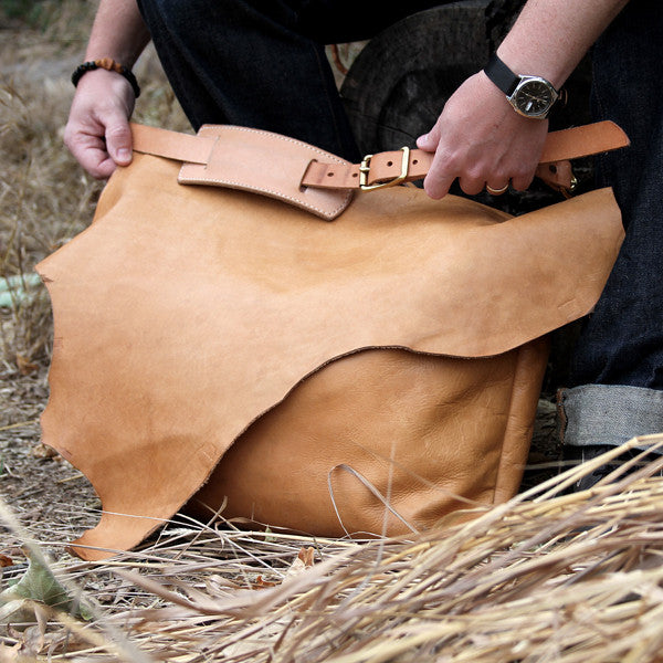 worn veg tan leather bag