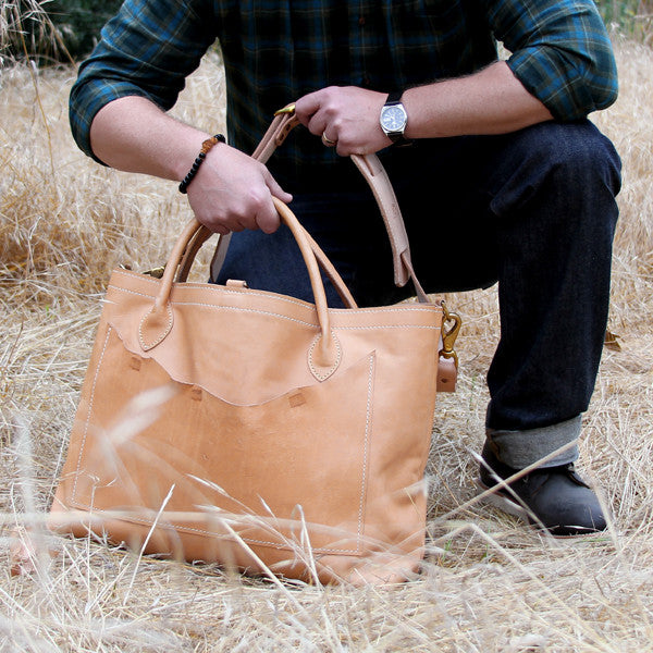 Large veg tan bag with man