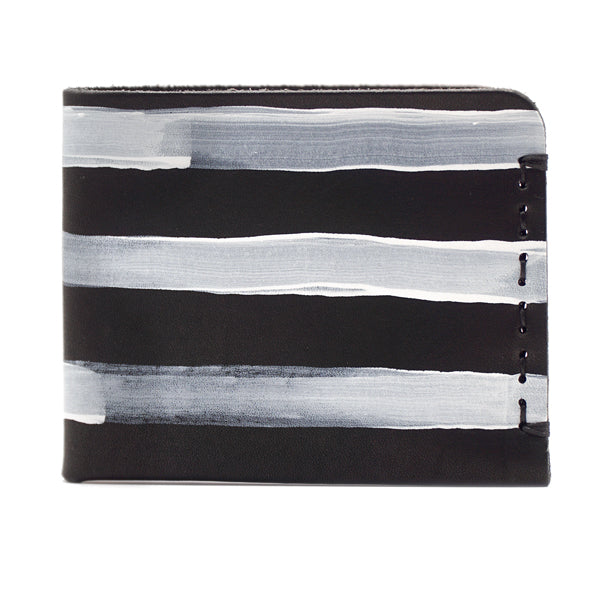 Black vegetable tanned leather wallet with white hand painted stripes side view