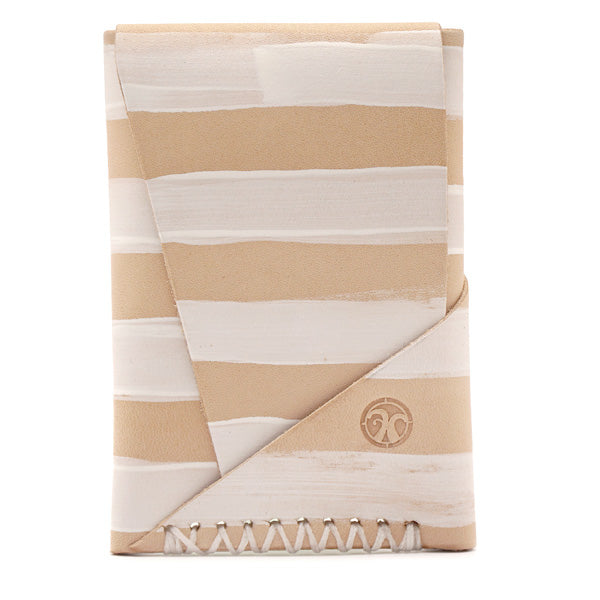Natural vegetable tanned leather with hand painted white stripes