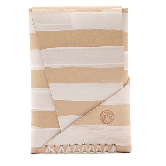 Natural vegetable tanned leather with hand painted white stripes