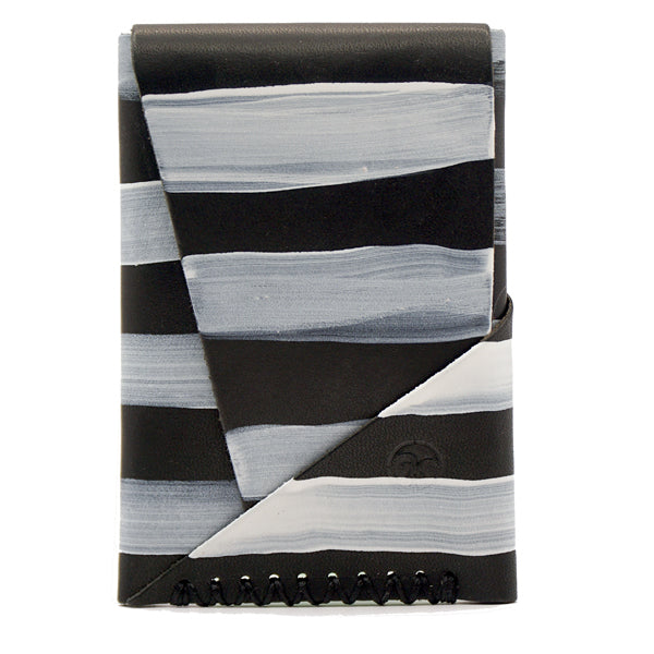 black vegetable tanned leather with hand painted white stripes