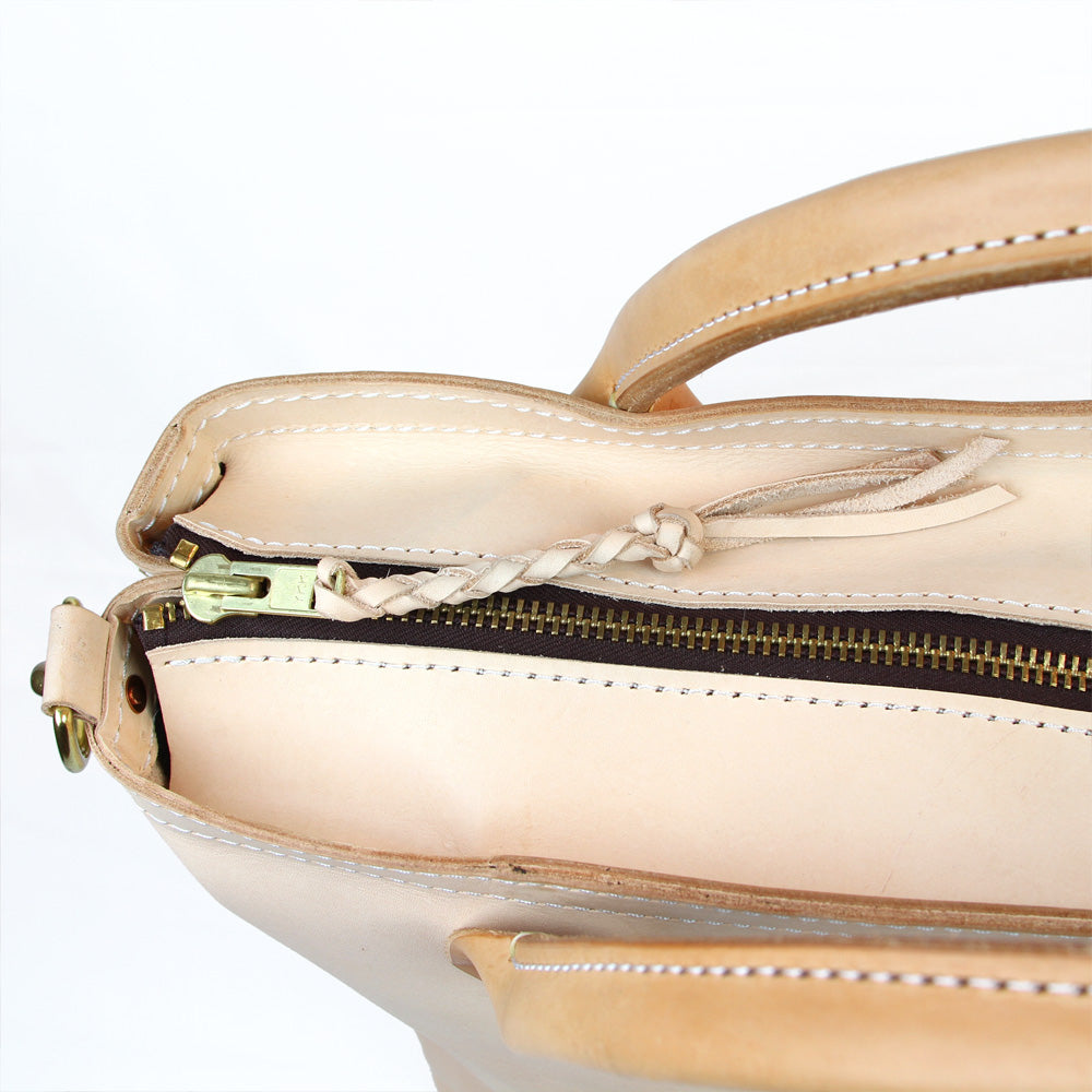 Large leather handmade veg tan travel bag braided zipper pull